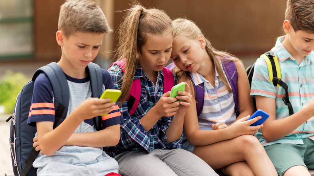 Kids on smartphones tech children school