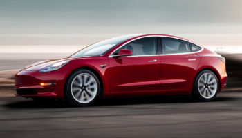 Model 3 Red Driving Sunset 1920