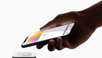 Apple Card hand iPhoneXS payment 032519 big.jpg.large 2x