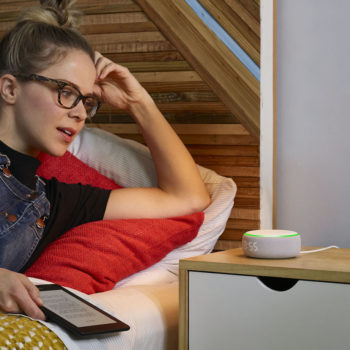 Amazon Echo Dot with Clock on bedside table