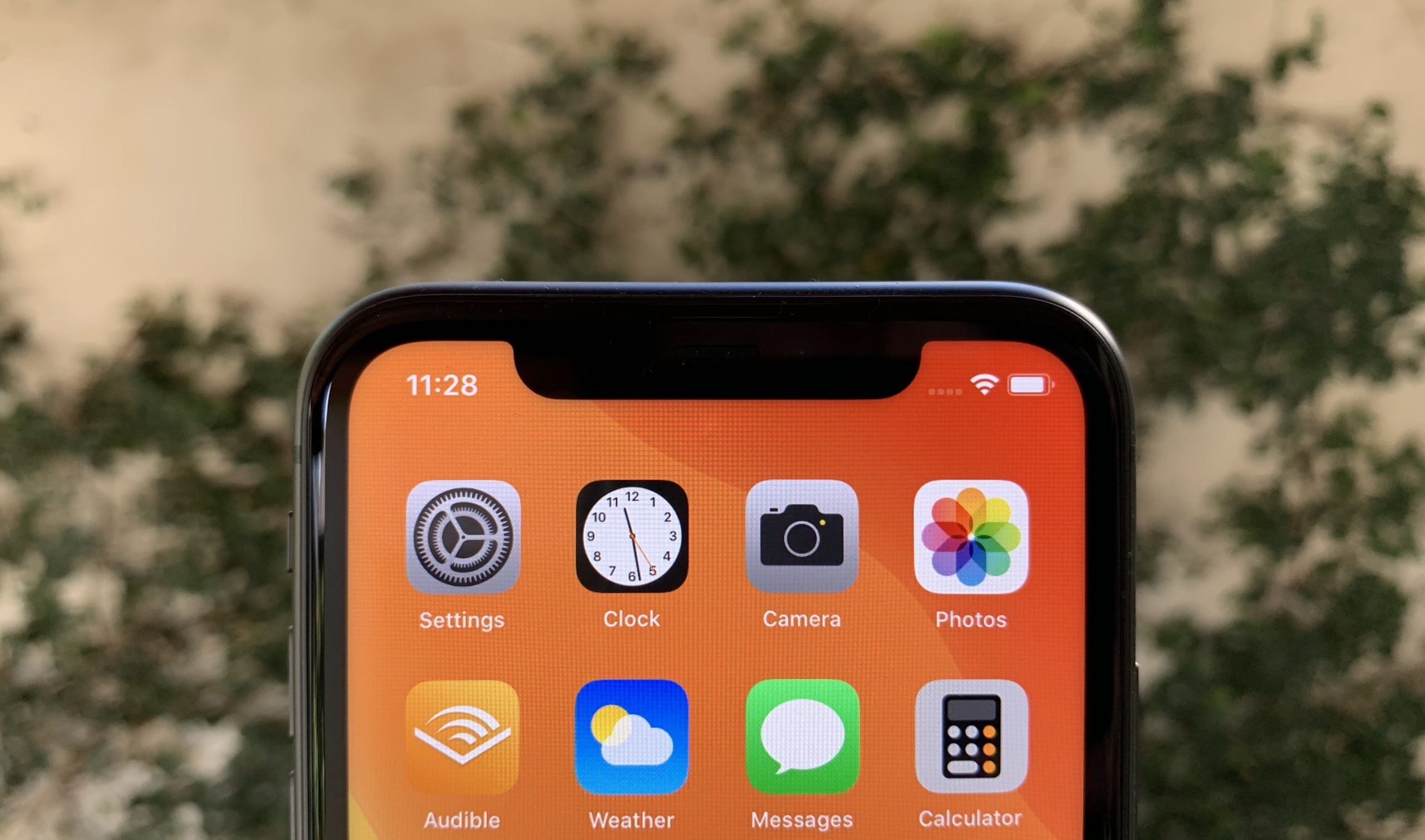 iPhone 11 notch hand scaled
