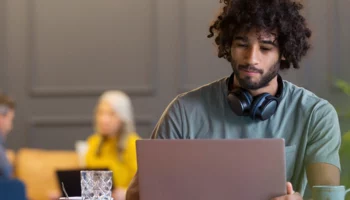 Man with headphones cafe 1920x60 1