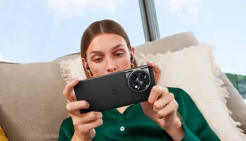 OnePlus 11 lifestyle Titan Black phone and Obsidian Black OnePlus Buds Pro 2 1