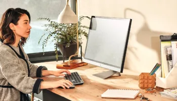 A female works on her Acer deskt