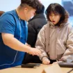 Apple Hongdae Seoul opening day team member helping customer