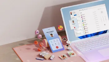 msft open laptop with mobile pho 1